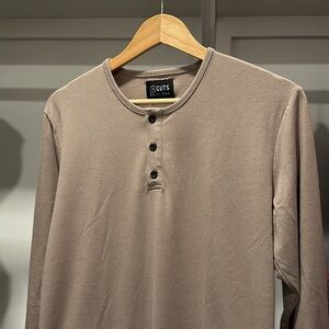 CUTS split hem men’s long sleeve Henley tan shirt.